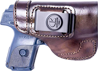 Gun inside brown leather holster